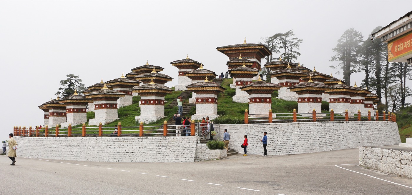 The 108 Druk Wangyal Chortens at Dochula Pass, with the Himalayan range behind