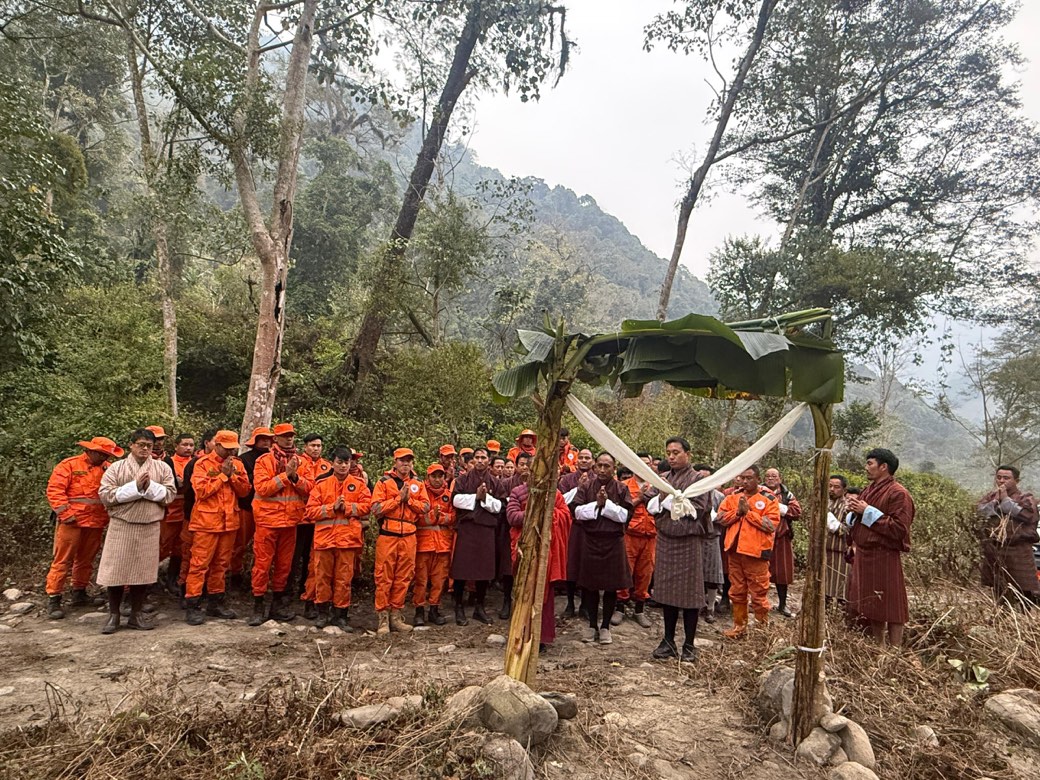 Volunteers and monks clearing the Lotus-Born Trail in southern Bhutan