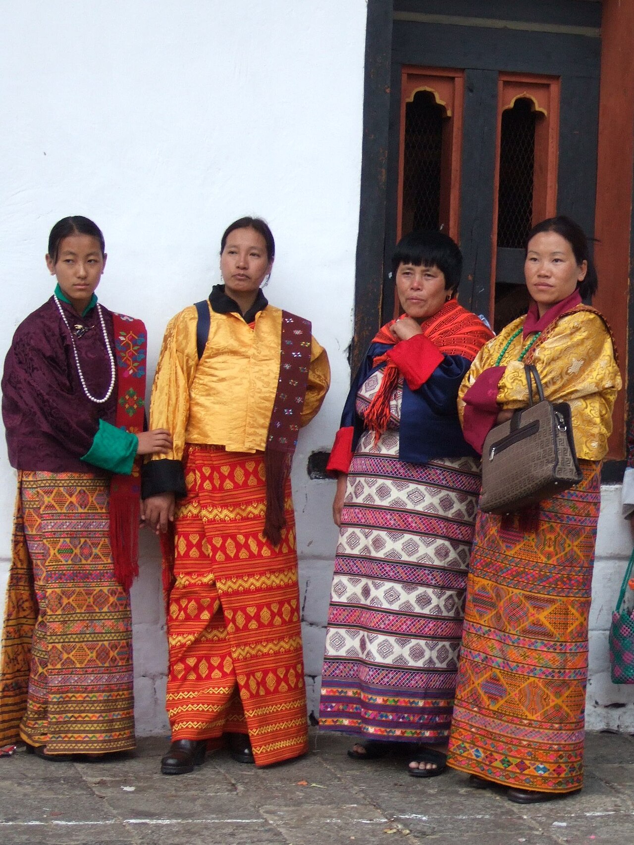 Bhutanese women wearing the kira at a festival